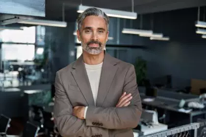 Confident middle aged older business man looking at camera in office, portrait.