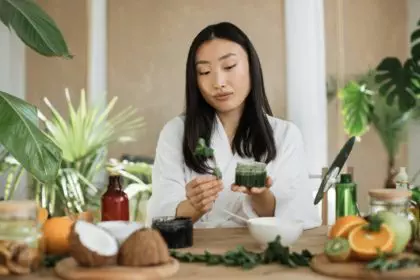 Young asian woman holding mint and making homemade cream for healthy skin.