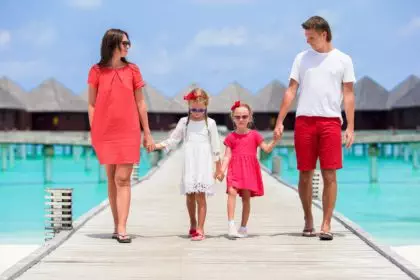 Young family on vacation have a lot of fun in Maldives